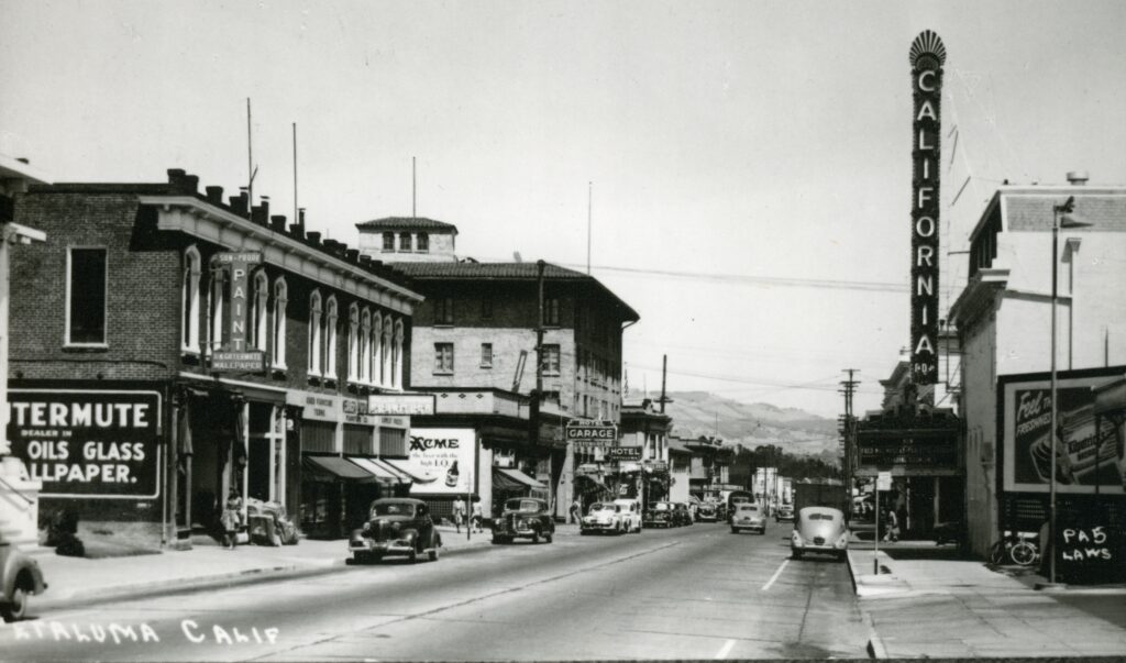 View looking east down Washington Street toward Keller Street, Petaluma. California Theatre on the right.  Credit: Sonoma County Library