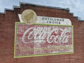 brick building with hand painted coca cola ad